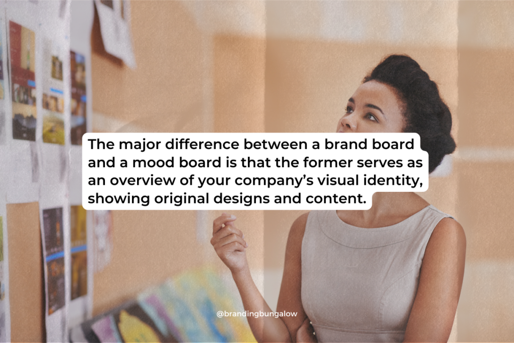 A woman staring up at a wall to develop branding boards.