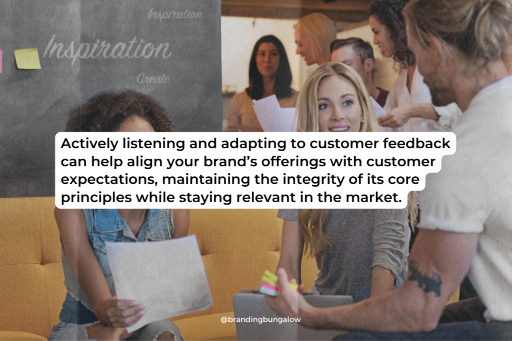 Teammates discuss customer feedback to help facilitate their brand.